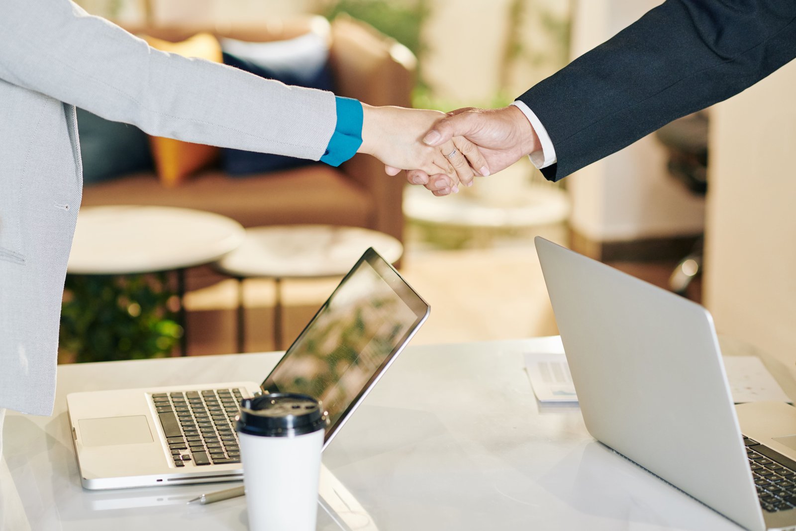 Professional handshake representing career opportunities
